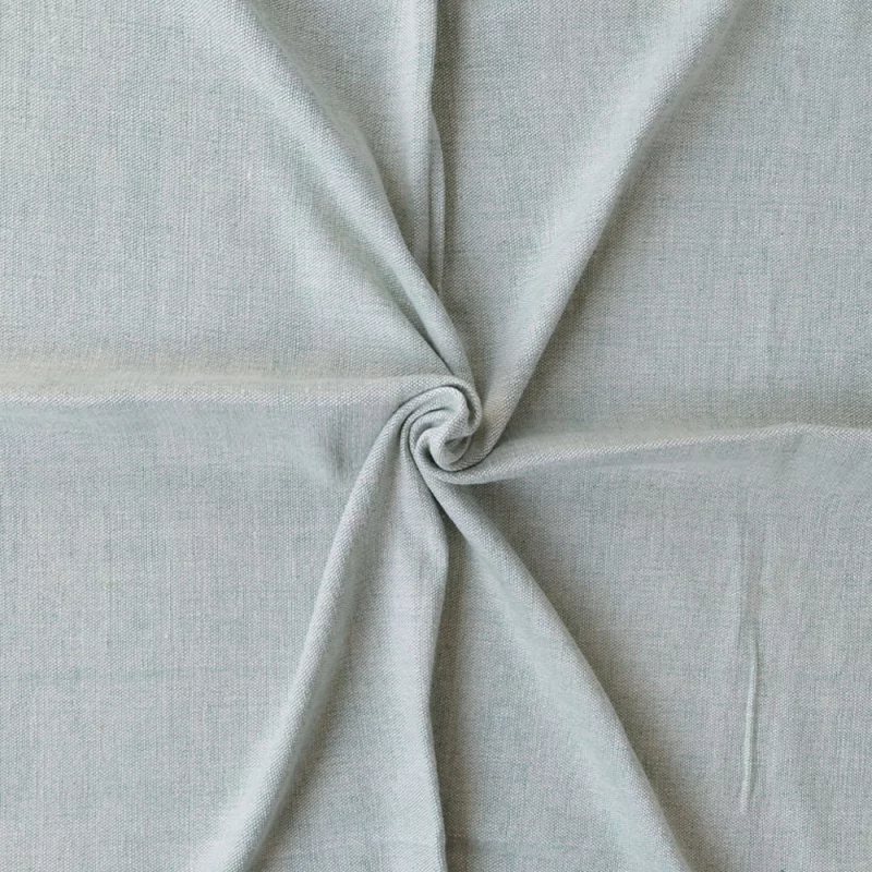 Handgewebte Yoga-Decke aus nachhaltiger Bio-Baumwolle in grün, ideal für Yoga und Entspannung.